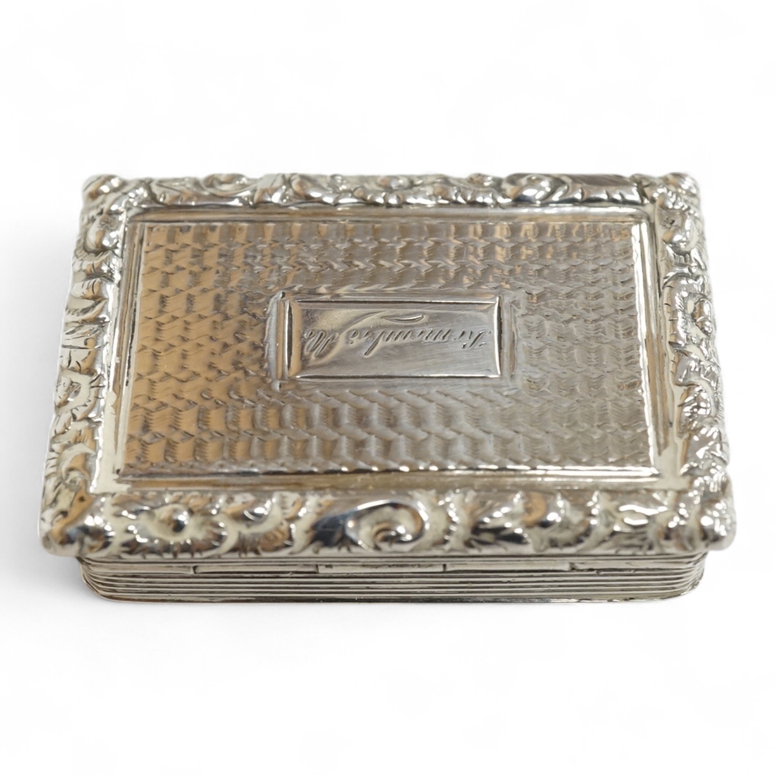 A William IV engine turned silver rectangular vinaigrette, by William Simpson, Birmingham, 1830, the central cartouche engraved 'Remember Me', 42mm (grille detached).